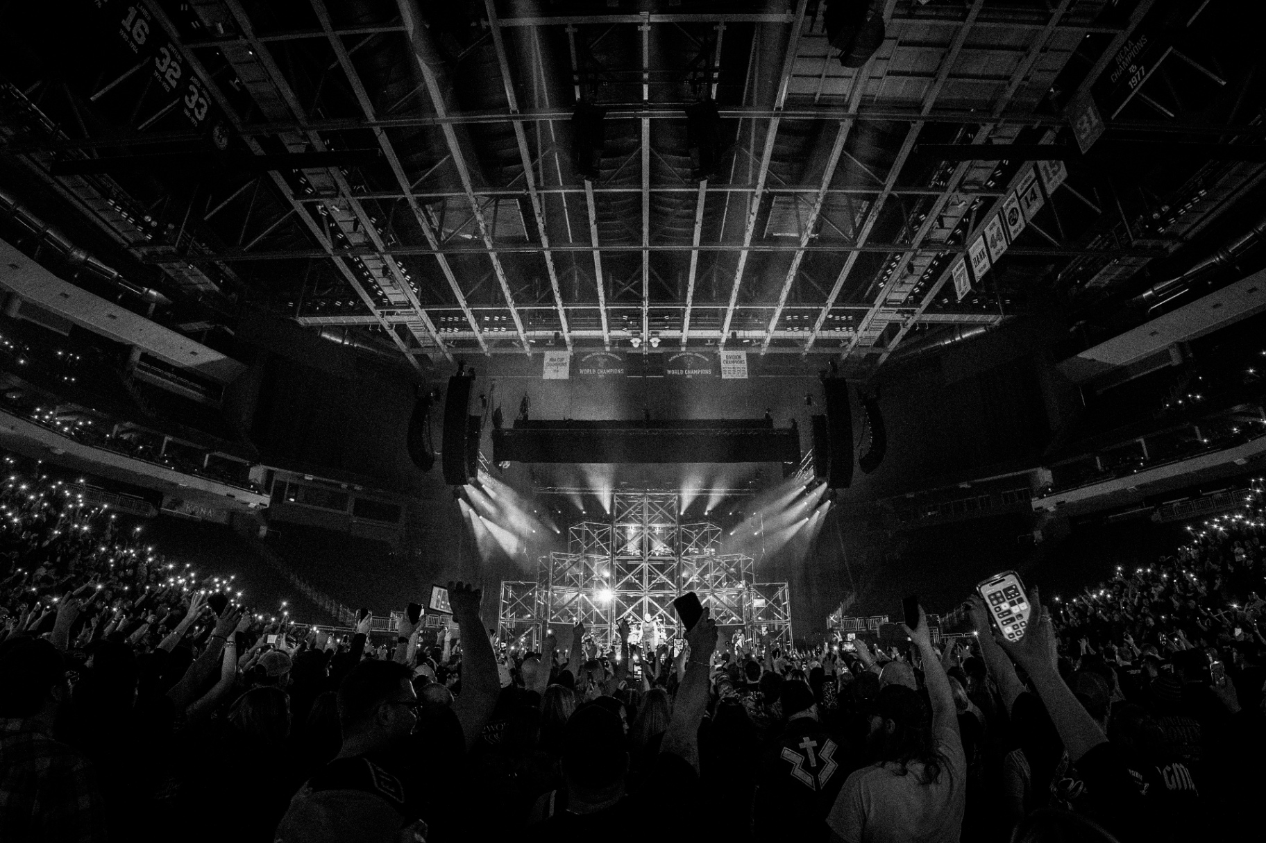 Arena crowd, phone lights up